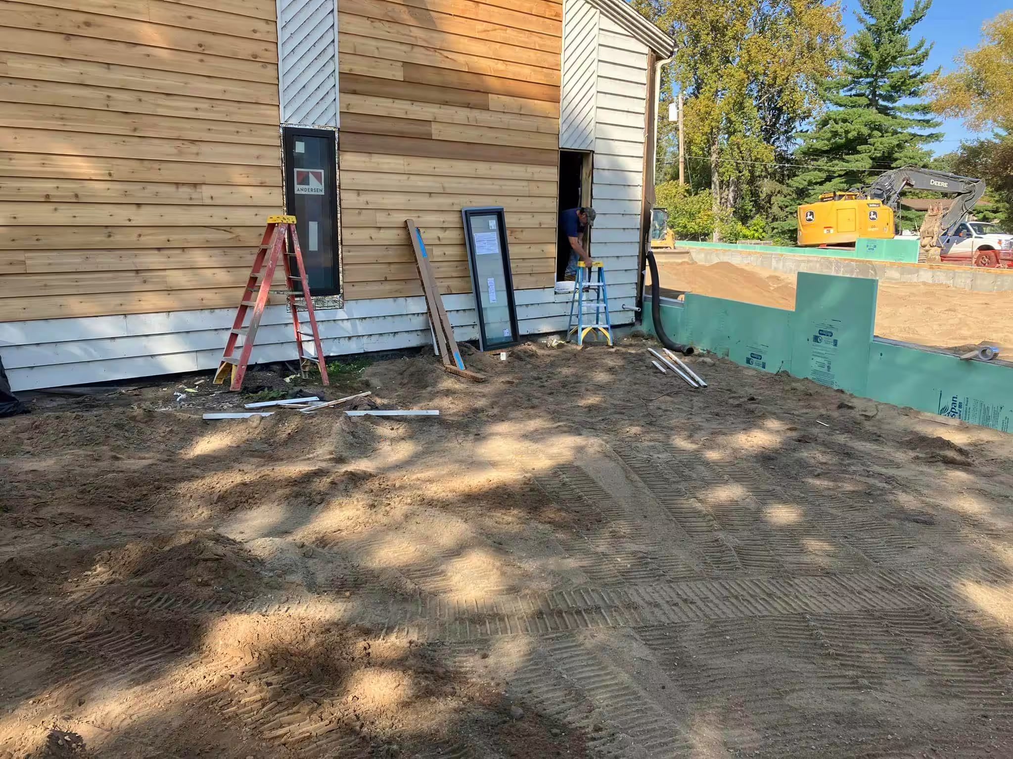New cedar siding going up during the Grace House expansion, September 2024