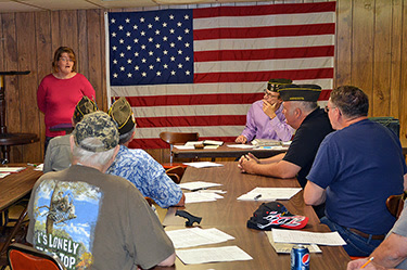 Nicole speaking at a local VFW board meeting about her time at Grace House